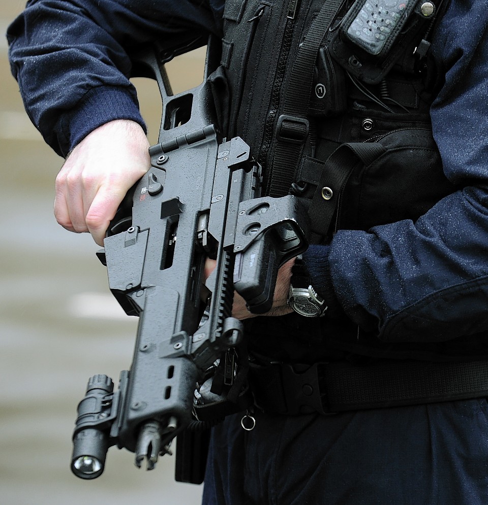Scotland will not slip into situation where police are routinely armed, according to justice secretary.